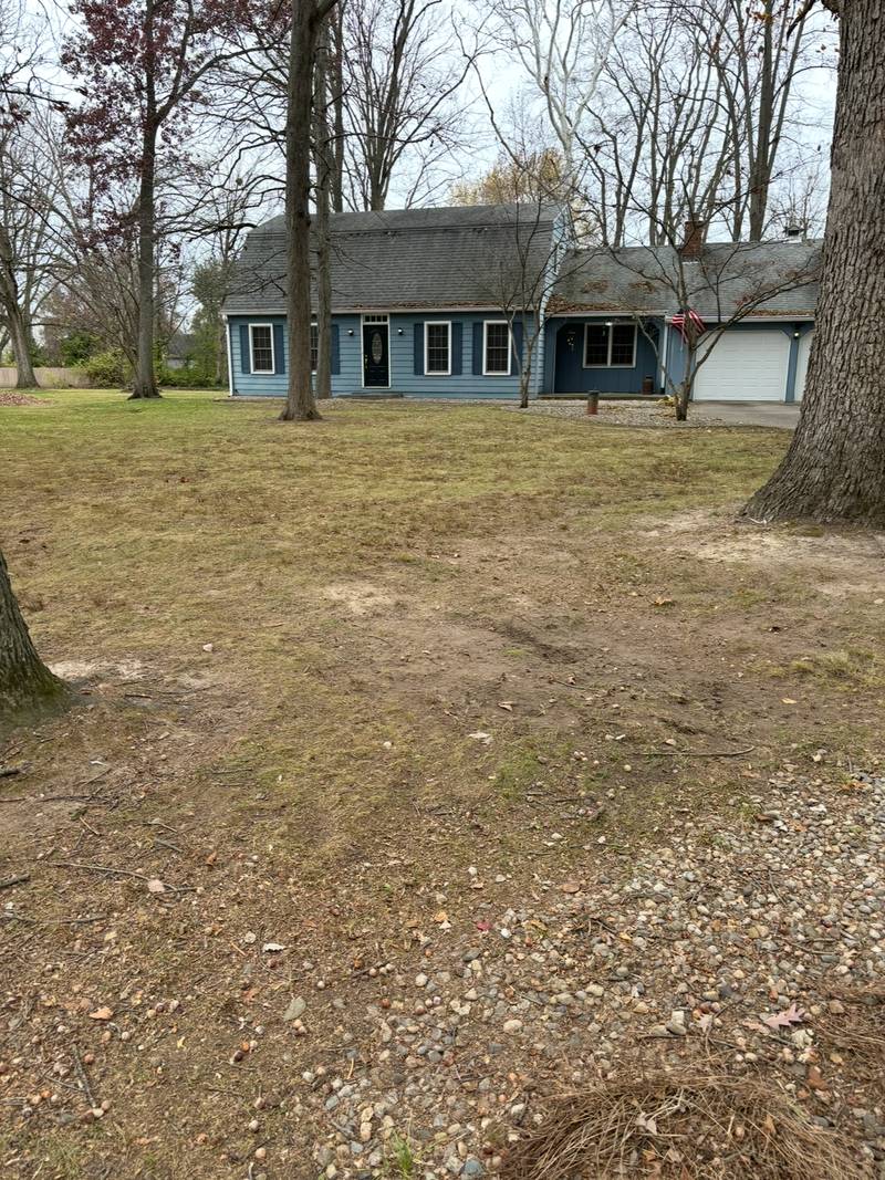 The same front lawn cleared down to the turf