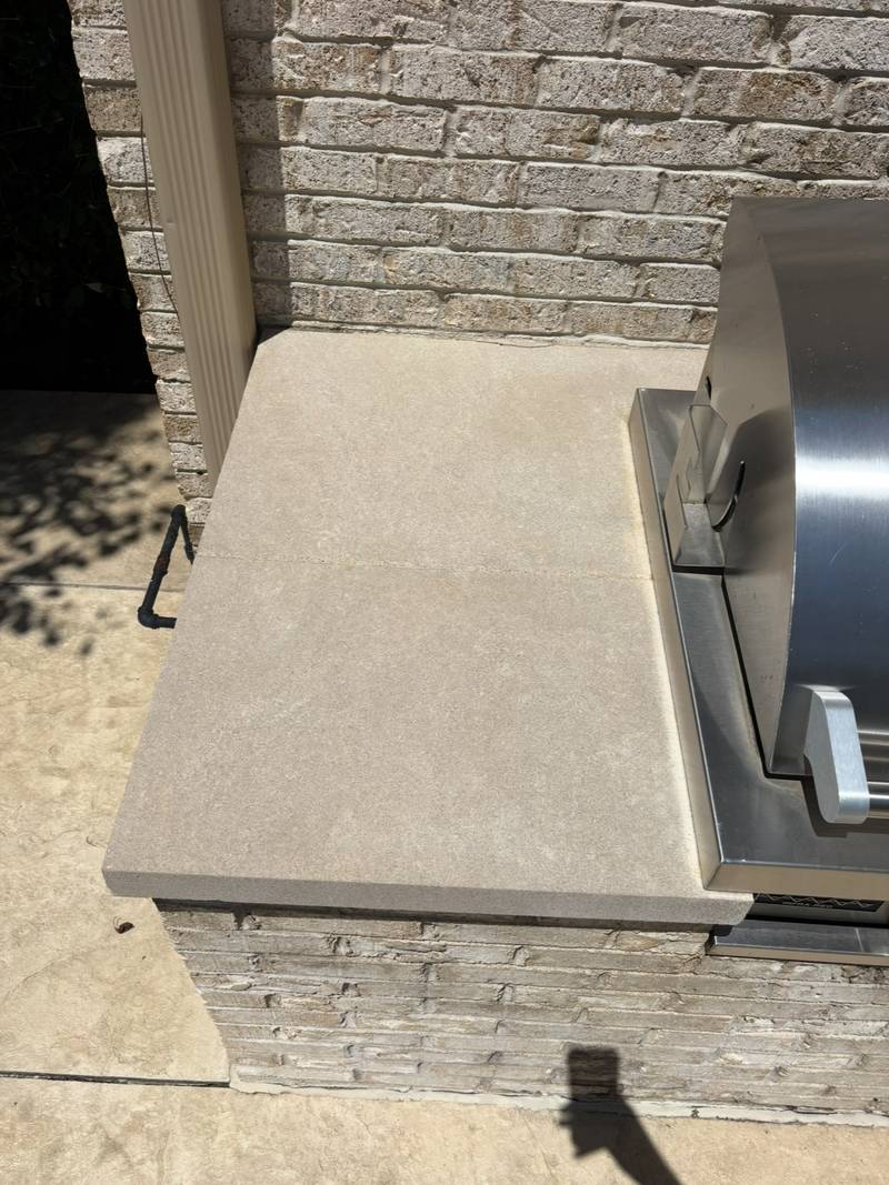 The same outdoor counter clean after pressure washing