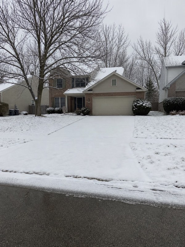 Illustration — snow-covered driveway before trigger-depth clearing